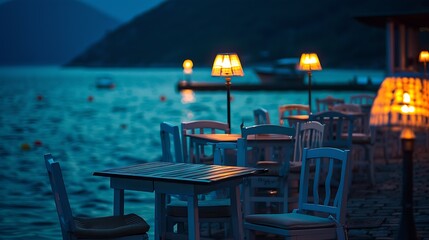 Beautiful cafe on sea coast at night in summer Landscape with chairs and tables lamps lights water blue sky at dusk Empty cozy cafe outdoor with illumination in Oludeniz Turkey Travel : Generative AI - obrazy, fototapety, plakaty