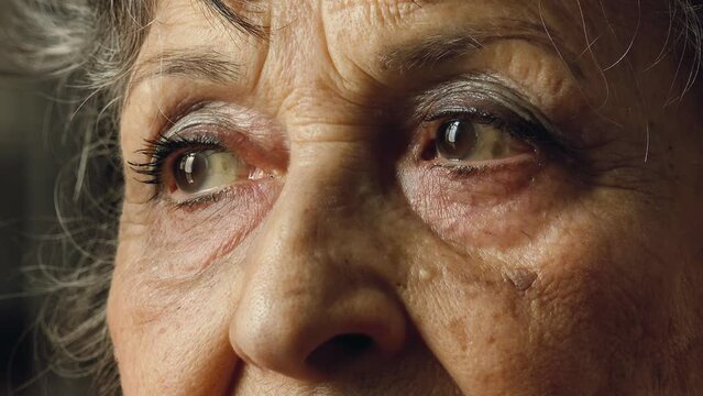 old woman eyes, closeup footage on pensive sad eyes