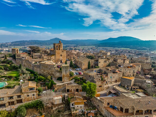 Naklejka premium Aerial view of Pals a medieval town in Catalonia, northern Spain, near the sea in the heart of the Bay of Emporda on the Costa Brava with city walls