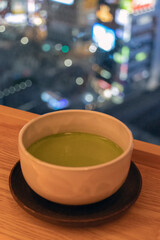 Matcha latte in a white bowl, photographed in Tokyo, Japan.