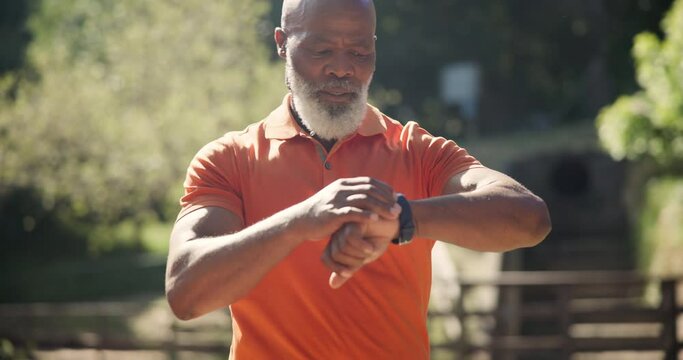 Senior fitness, running and black man with smartwatch in a park for wellness, training or morning cardio. Heartbeat, watch and African male runner in nature with pulse, calories or run steps check