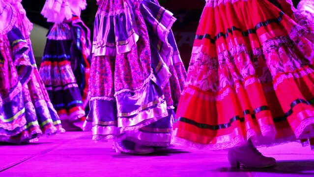 Closeup of women dancing a Mexican cultural folk dance showing the different ethnic dances of La Paz, Baja California Sur, Mexico in slow motion.