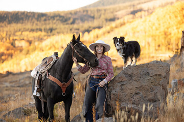 Colorado Cowgirl with dog and horse