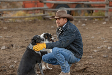 Cowboy with ranch dogs