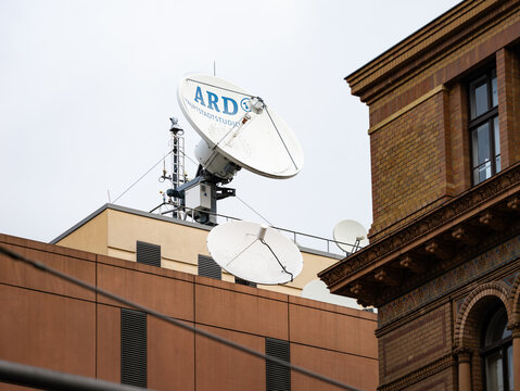 BERLIN, GERMANY - 7. February 2024: Satellite dish of the ARD Hauptstadtstudio (capital city studio) on the rooftop of the building. Sending a TV production with a parabolic antenna.