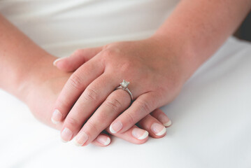 A wedding ring is a finger ring typically worn on the base of the left ring finger, indicates that...