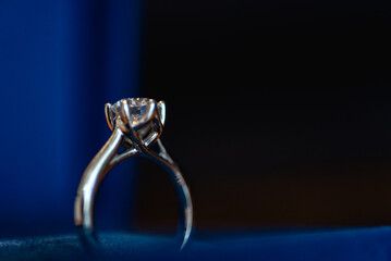 A wedding ring is a finger ring typically worn on the base of the left ring finger, usually forged from metal, traditionally gold or another precious metal. indicates that its wearer is married