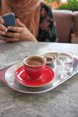 a cup of turkish coffee on table 
