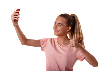 Portrait of beautiful young fit girl making selfie with smartphone and showing ok sign isolated on white background