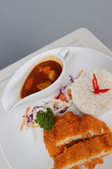 delicious japanese food dori fish katsu with curry and rice on a white plate