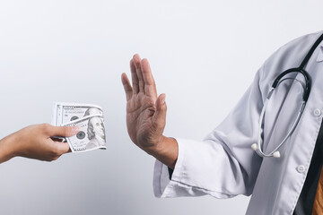 Doctor's hands refusing money from bribing. Bribery and anti corruption concept - obrazy, fototapety, plakaty
