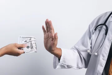 Fotobehang Doctor's hands refusing money from bribing. Bribery and anti corruption concept © Queenmoonlite Studio