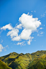 Fototapeta premium Sky, clouds and mountains for landscape background, environment and eco friendly nature in Europe. Aerial view of countryside, hill and river for green land, sustainability or summer weather in italy