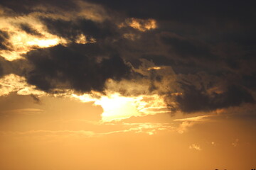 Dramatic sky at sunrise, natural background with cirrus and cumulus clouds