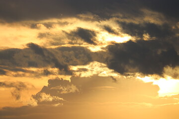 Fototapeta na wymiar Dramatic sky at sunrise, natural background with cirrus and cumulus clouds