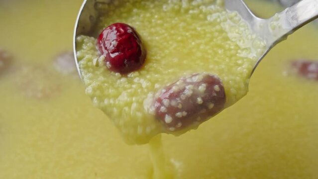 millet congee or millet porridge with jujube in pot	
