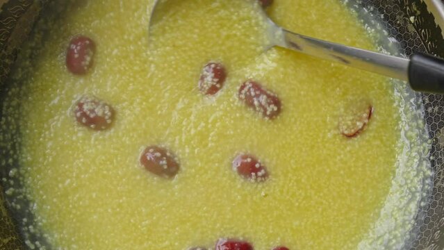 millet congee or millet porridge with jujube in pot	
