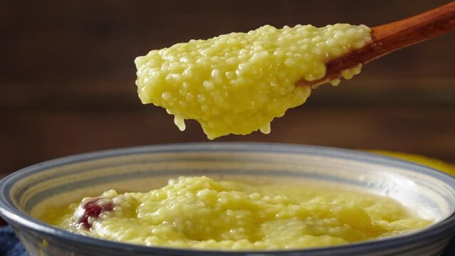 millet congee or millet porridge with jujube in a bowl on tabe.