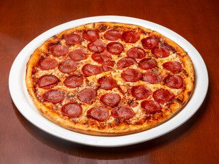 Italian Pepperoni pizza on a plate.