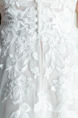 Close up of a  wedding dress or bridal gown, the dress worn by the bride during a wedding ceremony.