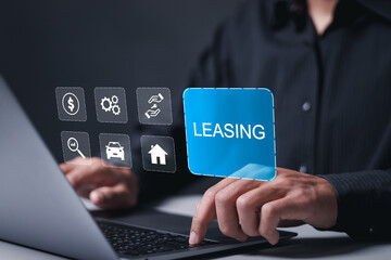 Leasing business concept. Businessman using laptop with leasing word and icons about contract agreement between lessee and lessor. - obrazy, fototapety, plakaty