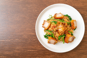 Stir-fried rice vermicelli and water mimosa with crispy pork belly
