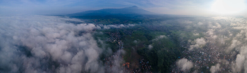 Where Mountains and its village below Meet Morning: A Panoramic Ascent Beyond the Clouds