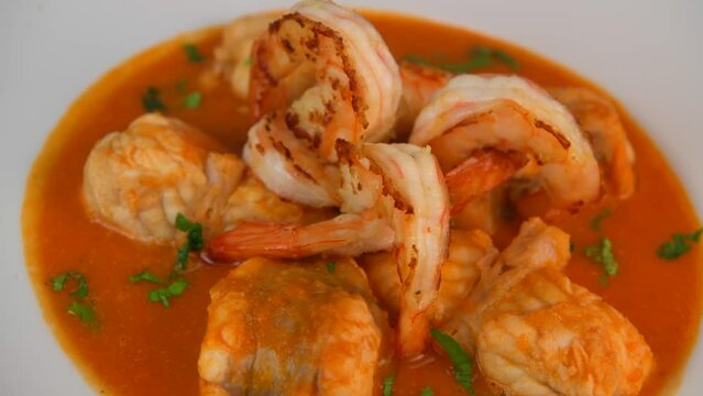 Recipe for Armorican-style monkfish tail, prawns, flambees with cognac, High quality video