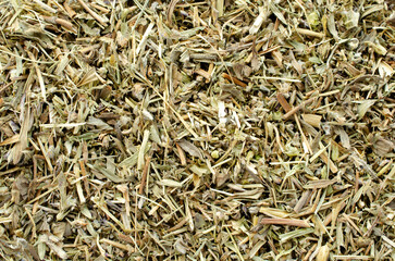 Dried thyme spice for food background, top view. Dry thyme mixture for brewing tea. Dry mixture of dried thyme, top view.