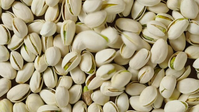roasted salted pistachio nuts background.