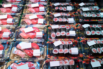 Various flesh sushi and sashimi ready to eat in plastic box package at Food shelves and freezers in seafood market - 738545794