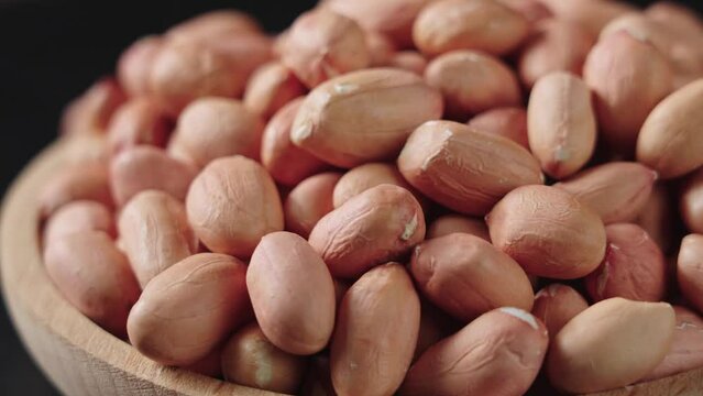 peeled raw peanut kernel on table.