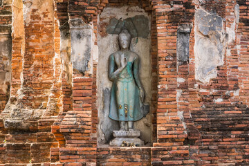 Fototapeta na wymiar Ayutthaya,Thailand - September,17, 2023: Broken Buddha statues in Wat Mahathat, Ayutthaya, Thailand