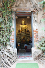 Buddha statue in old church at Wat Bang Kung, Amphawa distinct in Samut Songkhram province Thailand.