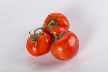 Sweet ripe tomatoes on the branch