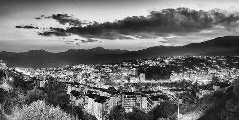 Fototapeta na wymiar Aerial view of Sanremo town and hills at sunset, Liguria - Italy