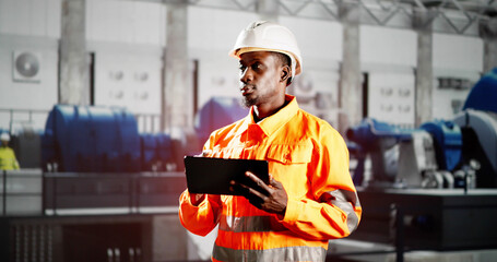 African Engineer Man Checking Industrial Facility