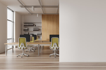 Office workspace interior with table and pc monitors, window. Mock up wall
