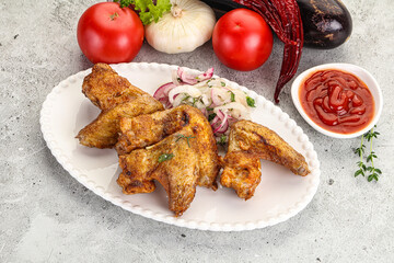 Grilled chicken wings with sauce