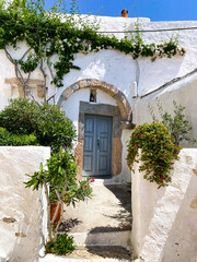 Patmian door with white Bougainvillea