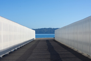Fenced path leading down a wharf in Wellington