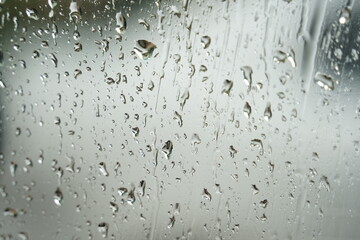 Rain drops on a  window. Blurred background. Close up