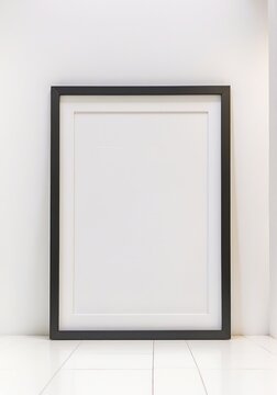 Blank black picture frame on the white interior