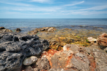 Fototapeta na wymiar Rocky and stones seashore