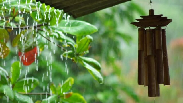 tranquility moment  with wind chimes on the porch when it rains