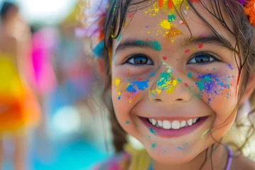 Foto op Aluminium Joyful Child with Colorful Holi Festival Paints A young girl smiles brightly, her face adorned with vibrant colors during a Holi festival celebration.  © nialyz