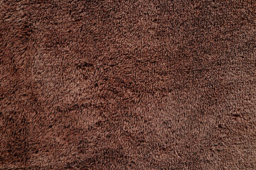 Absorbent fabric texture. Closeup of brown towel