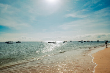 Scenic view of beach with fishing boats at the background at Malindi Beach in Malindi, Kenya