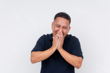 A middle-aged Asian man laughing joyously. Bursting into laughter, trying in vain to cover mouth...