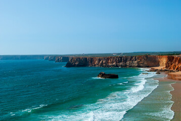 the south of Portugal in the Algarve with the splendid coast and rocky walls - obrazy, fototapety, plakaty